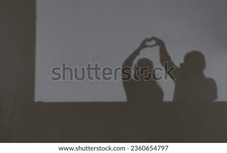 Loving couple shadow selfie in dark Royalty-Free Stock Photo #2360654797