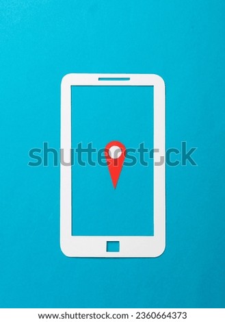Paper cut smartphone icon with gps navigation point on blue background