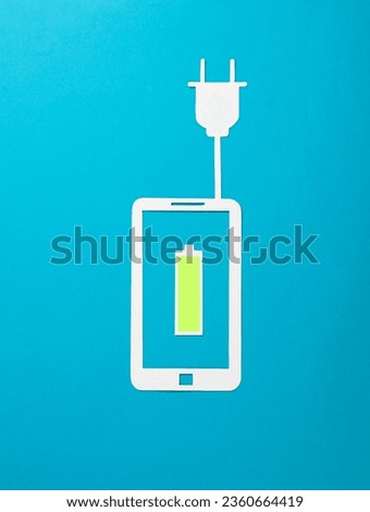 Paper-cut smartphone icon with fully charged battery and electric plug on blue background