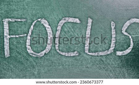 Written word FOCUS on chalkboard