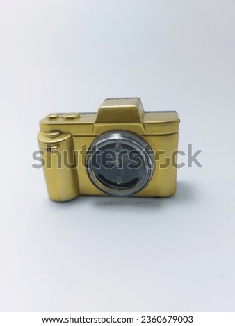 A gold children's toy camera with lights inside is very unique and nice