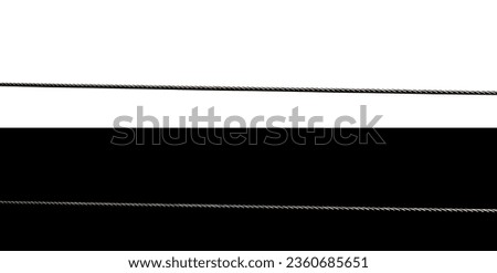 Metal rope for rappelling on a white an black background Royalty-Free Stock Photo #2360685651