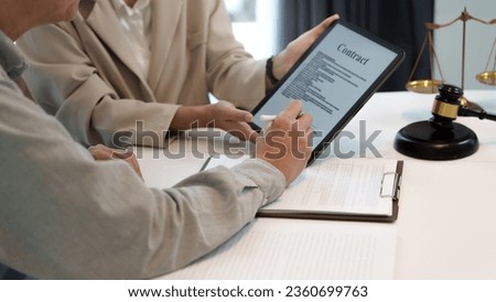 Business people hand electronic Signature on Tablet with contract policy 