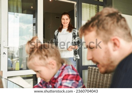 Focused father spending time with daughter at laptop computer