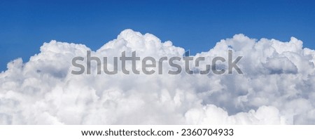 White clouds from below on the background of the blue sky