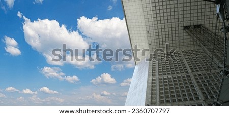 La Grande Arche (against the background of sky with clouds). La Defense, commercial and business center of Paris, France 