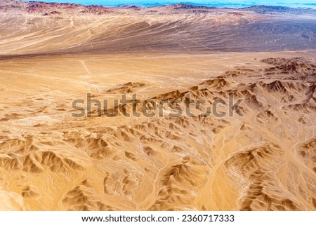 Aerial view of dry rivers and mountains in the altiplano of the Atacama Desert, Chile.