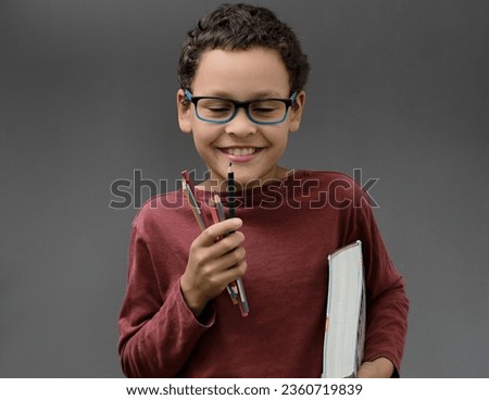 boy looking at educational book at school acting surprised with people stock image stock photo