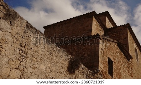 old building with stone construction facade against the sky