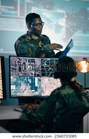 Military control room, computer and woman with team leader, headset and tech in communication. Security, surveillance management and soldier with black man in army office at government command center Royalty-Free Stock Photo #2360731085