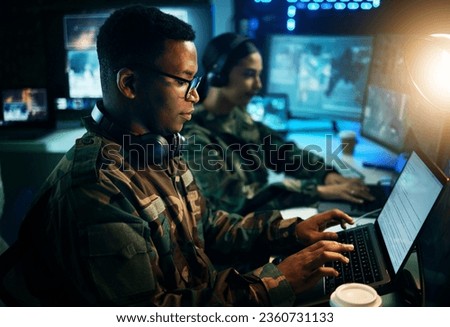 Military control room, computer and soldier at desk, typing code and tech for communication army office. Security, global surveillance and black man at laptop in government cyber data command center. Royalty-Free Stock Photo #2360731133