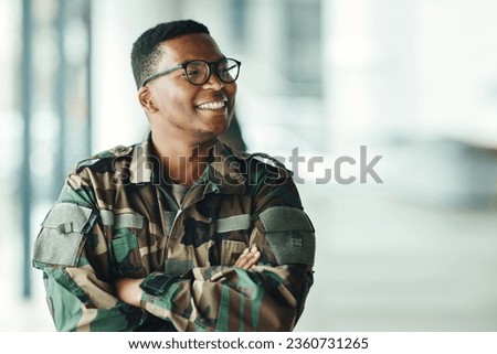 Soldier with smile, confidence and arms crossed at army building, pride and happy professional in sevice. Military career, security and courage, black man in camouflage uniform at government agency. Royalty-Free Stock Photo #2360731265