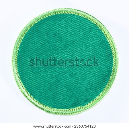 Green circular patch with a neon green trim. Royalty-Free Stock Photo #2360754123