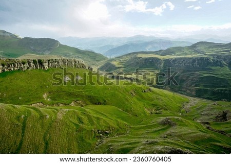 Picturesque green valley and mountains in Dagestan republic in Russia Royalty-Free Stock Photo #2360760405
