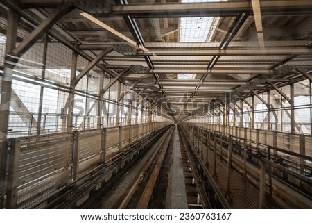 Train tracks of the Yurikamome line on the Rainbow Bridge, a suspension bridge in Tokyo, Japan Royalty-Free Stock Photo #2360763167