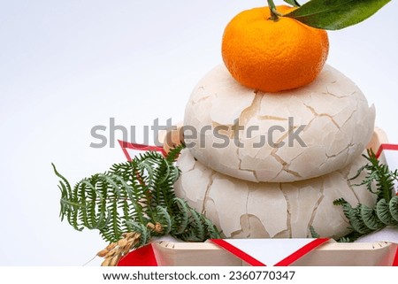 Pictures of broken Kagamimochi.
Kagamimochi is an offering to the gods.
It cracks after being offered for several days. Royalty-Free Stock Photo #2360770347