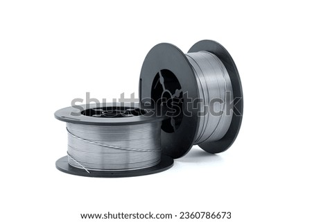 Flux cored welding wire for gasless welding isolated on white background Royalty-Free Stock Photo #2360786673