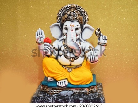Lord Ganesha Idol on golden Background, Happy Ganesh Chaturthi. Ganpati Bappa Morya. ganesh festival