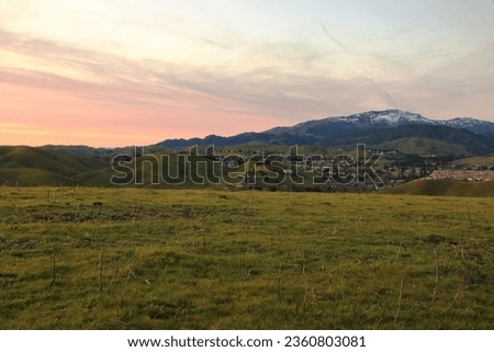 Sunset over the East Bay hills with snow on Mt Diablo in the background Royalty-Free Stock Photo #2360803081