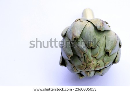 Fresh artichoke on white background.