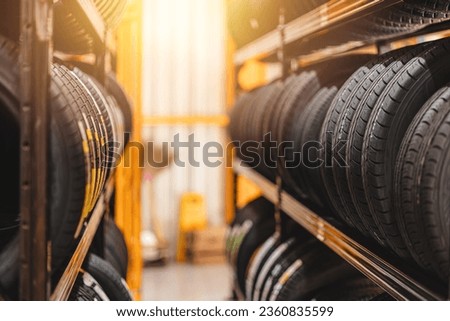 new car tire mix type on storage shelf at warehoue stock inventory in auto garage workshop for sale Royalty-Free Stock Photo #2360835599