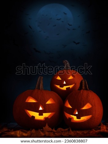 Halloween pumpkins and the moon on background with copy space