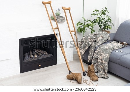 military uniform camouflage with crutches.