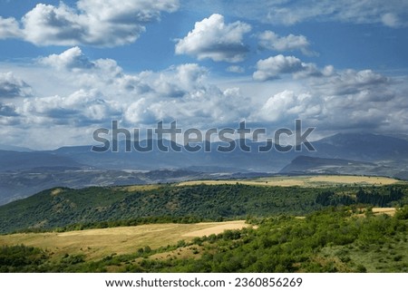 Beautiful landscape with hills, mountains and blue sky