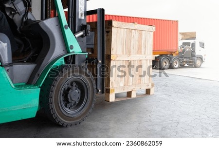 Forklift Tractor Unloading Wooden Crates at Warehouse. Container Truck Loading Dock Warehouse. Cargo Sending to Customers. Shipment Supplies Warehouse Shipping. Freight Truck Logistic Transport. 