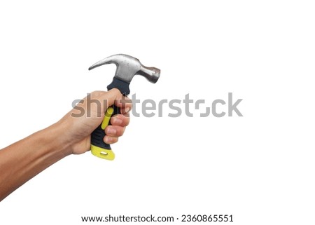 A man's hands are holding tools such as a hammer and screwdriver.