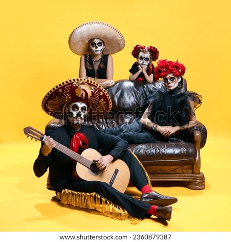 Halloween Family. Father playing on guitar, mother and children in halloween skeleton spooky makeup. trick or treat. Halloween traditions. Concept of autumn, holidays, zombie, party.