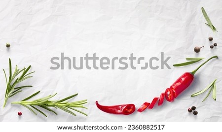 Fresh herb rosemary and red chilli pepper on white cooking paper background. Ingredient, spice for cooking. cooking banner design collection 
 Royalty-Free Stock Photo #2360882517