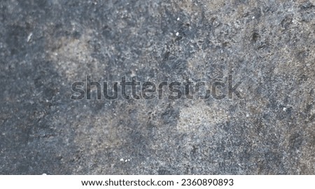 photo of natural stone. The background of the rough stone texture is black or dark gray, yellowish