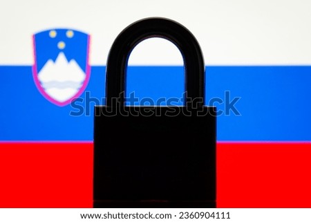Silhouette of closed lock against flag of Slovenia. Inability to choose Slovenia country from the list, ban to enter country