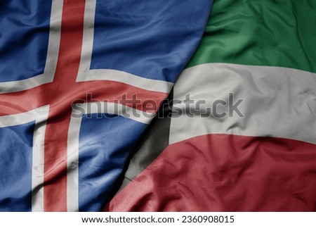 big waving national colorful flag of icelandic and national flag of kuwait . macro