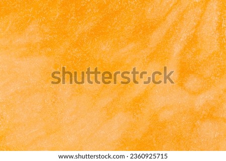 abstract natural background: close up of orange juicy pulp of pumpkin texture
