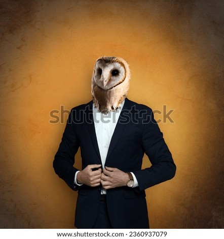 Portrait of businessman with owl face on orange gradient background