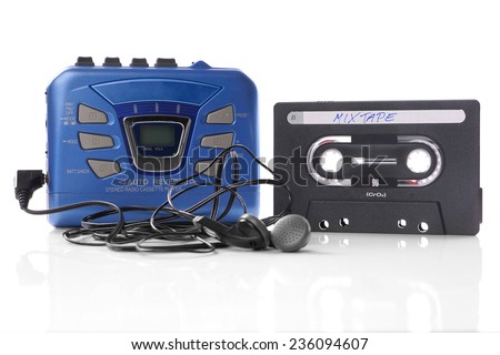 old-fashioned music cassette and walkman player with earphones Royalty-Free Stock Photo #236094607