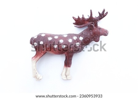 Deer toy isolated on white background. Plastic or rubber deer toy on white background.