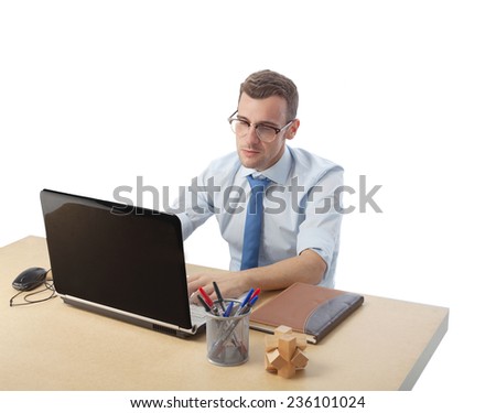 man in office looking at the computer