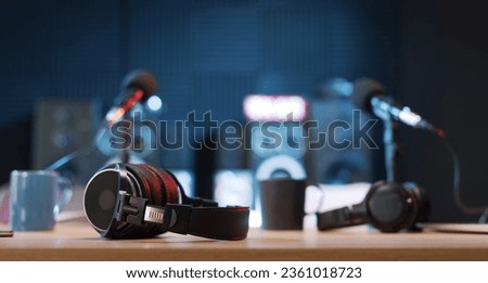 Radio broadcasting station professional equipment: headphones in the foreground