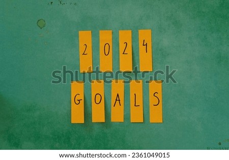 2024 goals. Paper tags with 2024 goals written. Concept photo of planning new years resolutions and goal setting