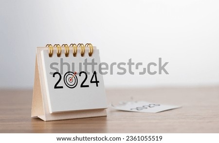 2024 Happy New year background. Turns over a calendar sheet. Setup objective target business cost and budget planning of new year concept. year change from 2023 to 2024. Royalty-Free Stock Photo #2361055519