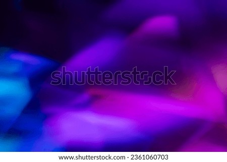 Blur neon light. Lens flare overlay. Bokeh fluorescent flash gleam. Defocused blue purple color flecks on dark black abstract background. Royalty-Free Stock Photo #2361060703