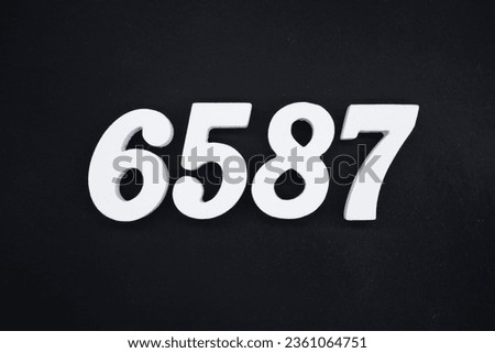 Black for the background. The number 6587 is made of white painted wood.