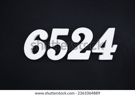 Black for the background. The number 6524 is made of white painted wood.