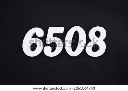 Black for the background. The number 6508 is made of white painted wood.