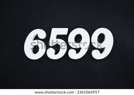 Black for the background. The number 6599 is made of white painted wood.