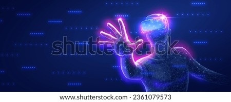 A man using a VR device for an immersive virtual experience. Virtual reality, 3D experience, augmented reality, AI technology, entertainment industry, educational 3d, futuristic learning Royalty-Free Stock Photo #2361079573