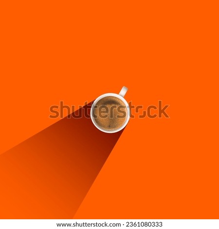 Top view of fresh, tasty, aromatic black coffee, americano, espresso in cup isolated over orange background. Concept of popular drink, taste. Minimal design. Copy space for ad. Flyer